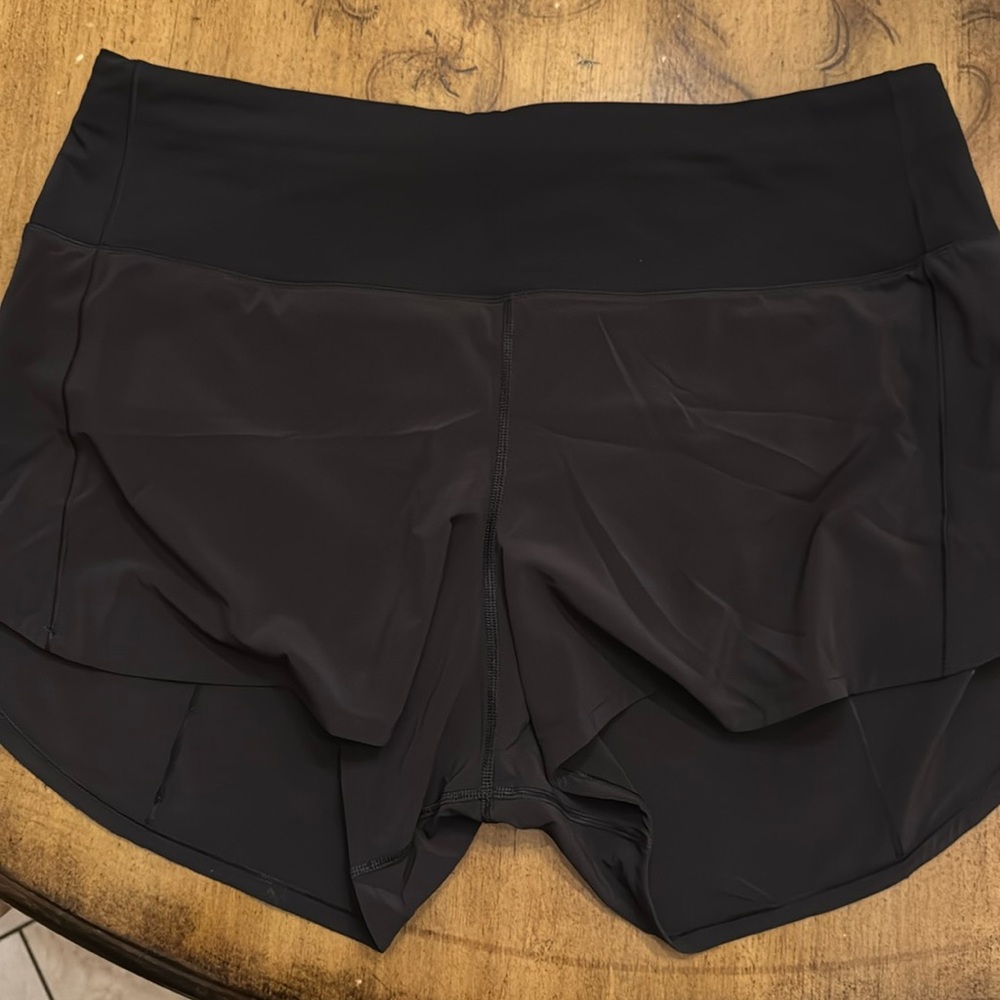 Lululemon black high waist 4” speed up size 12